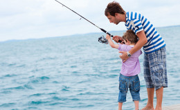 Fisherman fishing on boat big game tuna, blue sunny sky